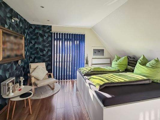 Schlafzimmer mit Balkonzugang