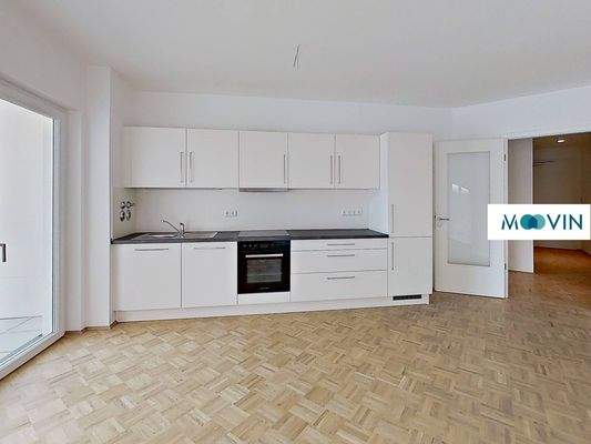 Ansicht II: Wohn- und Esszimmer mit Blick auf die Einbauküche