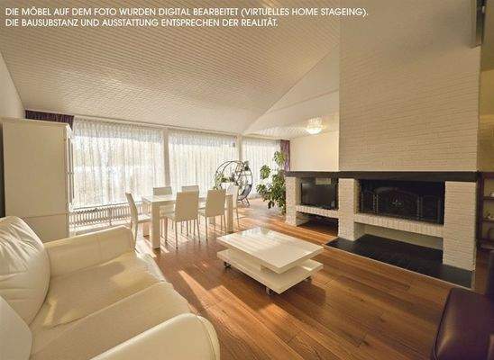 Wohnzimmer mit ca. 8 m Fensterfront und Kamin 