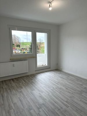 Wohnzimmer mit Balkon