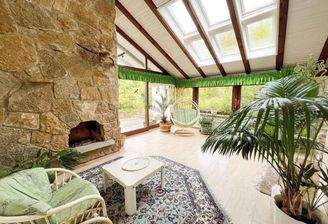 Wintergarten mit offenem Kamin