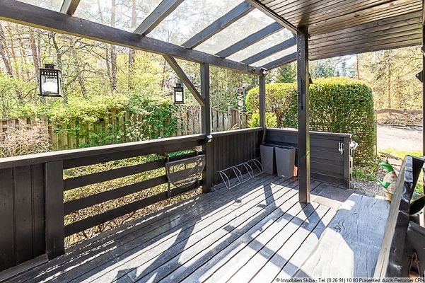 Veranda mit Glasüberdachung