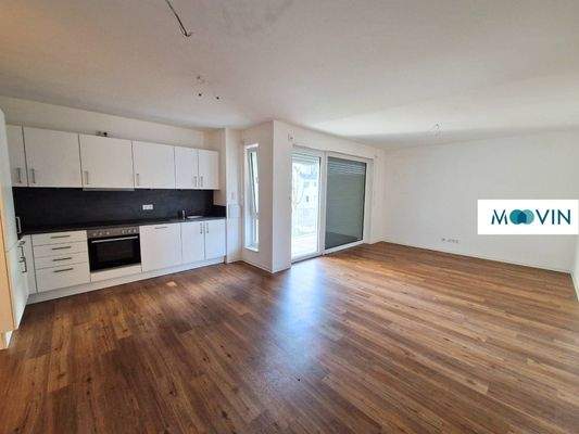 Ansicht I: Wohn- und Esszimmer mit offenem Küchenbereich