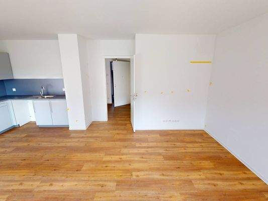 Ansicht II: Wohn- und Esszimmer mit offenem Küchenbereich