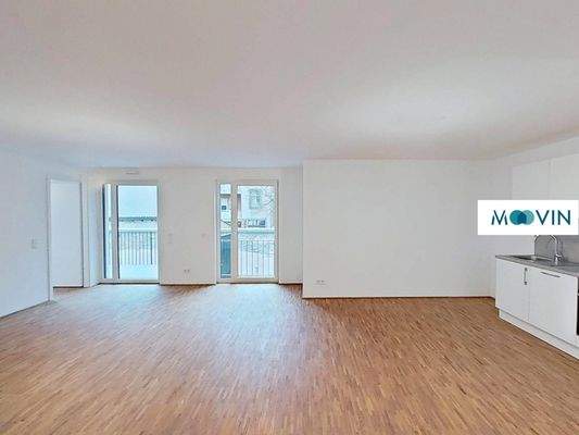 Ansicht II: Wohn- und Esszimmer mit offenem Küchenbereich