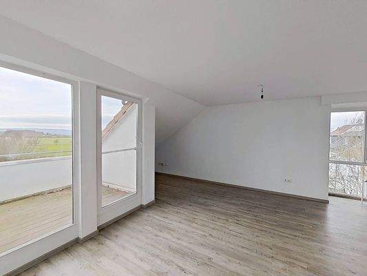 Ansicht II: Wohn- und Esszimmer mit offenem Küchenbereich