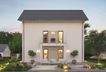 Dieses massa haus Fertighaus Einfamilienhaus im Lifestyle-Design präsentiert bei Abenddämmerung sein