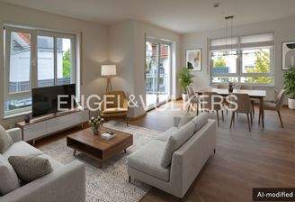 Der Wohn- und Essbereich mit Zugang zum Balkon und großen Fenstern ist lichtdurchflutet