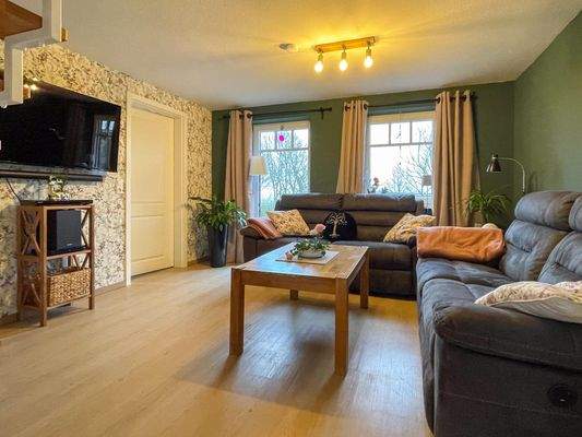 Wohnzimmer mit Zugang zur Terrasse