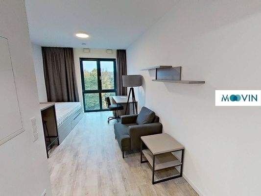 Ansicht I: Wohn- und Schlafzimmer mit offenem Küchenbereich