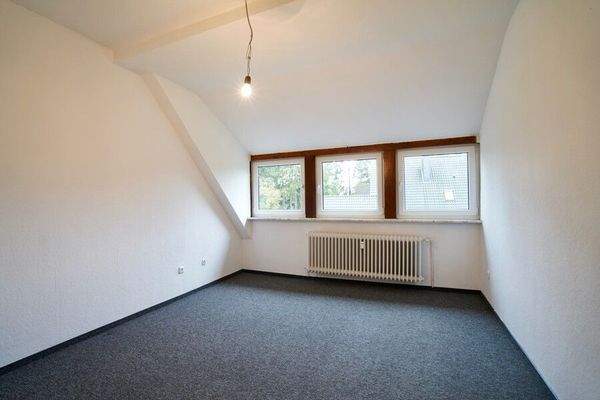 Schlafzimmer an der Küche - Wohnung 1 im Dachgeschoss