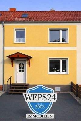 Hausansicht mit Logo