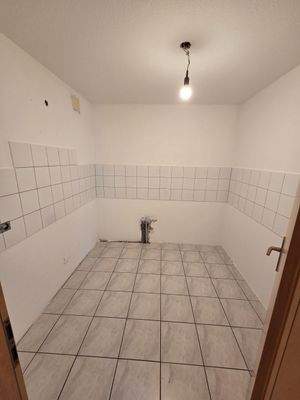 Küche mit Fliesenboden