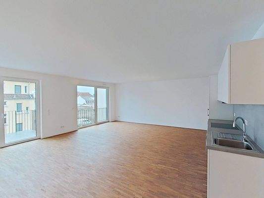 Ansicht II: Wohn- und Esszimmer mit offenem Küchenbereich