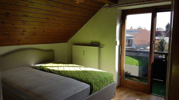 Schlafzimmer mit Balkonzugang