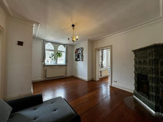 Living and dining room with tiled fireplace