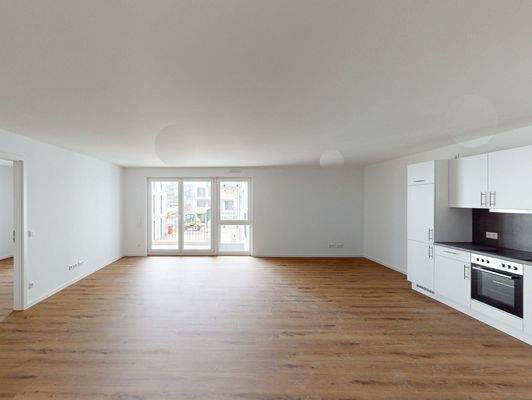 Wohnzimmer mit offener Küche