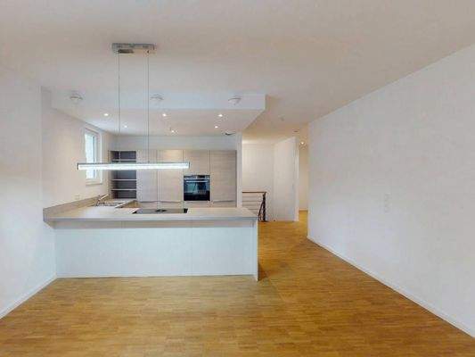 Ansicht II: Wohn- und Esszimmer mit offenem Küchenbereich