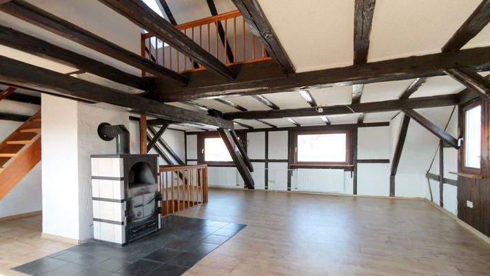 Wohnbereich mit Holzofen Dachgeschoss