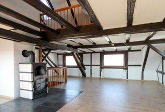 Wohnbereich mit Holzofen Dachgeschoss