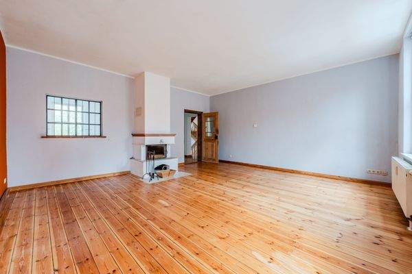 Dining and living area with fireplace 