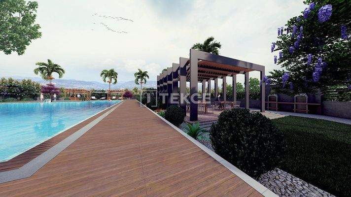 New Apartments in Mersin with a Pool and Modern Landscaping