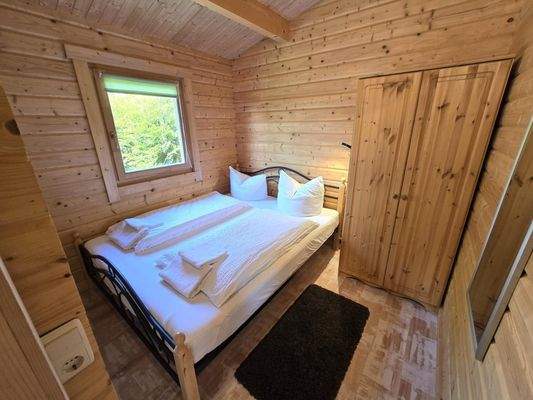 Schlafzimmer - Blockhütte