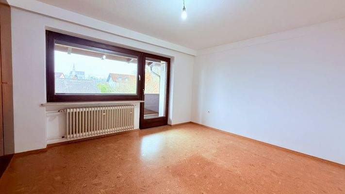 Schlafzimmer mit Balkonzugang