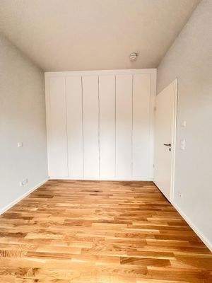 Schlafzimmer mit Parkettboden