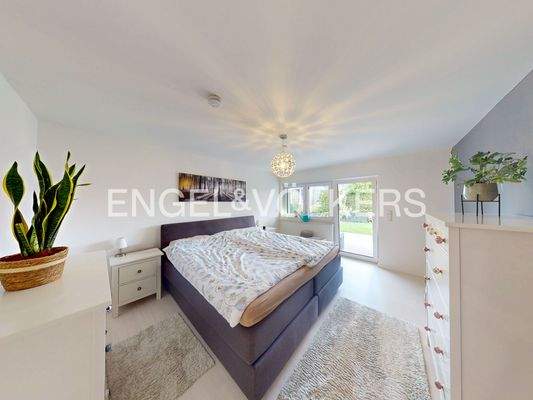 Schlafzimmer im Gartengeschoss mit Zugang zur Terrasse