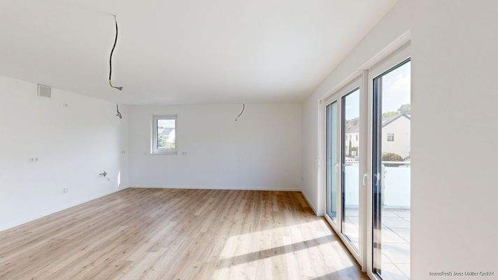 Wohnzimmer mit  Blick zum Küchenbereich