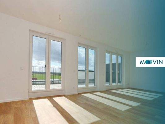 Ansicht I: Wohn - und Esszimmer mit offener Küche