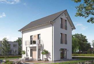 Dieses massa haus Fertighaus Einfamilienhaus im Lifestyle-Design präsentiert sich bei Tageslicht mit