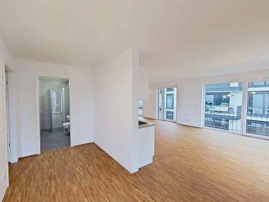 Ansicht VI: Wohn- und Esszimmer mit offenem Küchenbereich