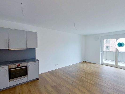 Ansicht I: Wohn- und Esszimmer mit offenem Küchenbereich