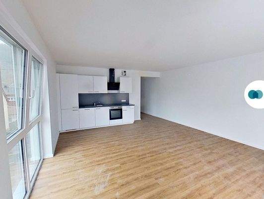 Ansicht II: Wohn- und Esszimmer mit offenem Küchenbereich