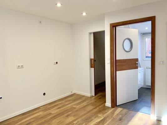 und großzügige Wohn-, Ess- und Küchenbereich. 