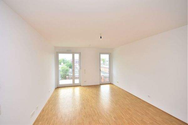 Wohnzimmer mit Balkon