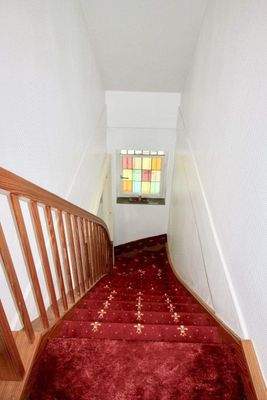 Treppe in das Obergeschoss