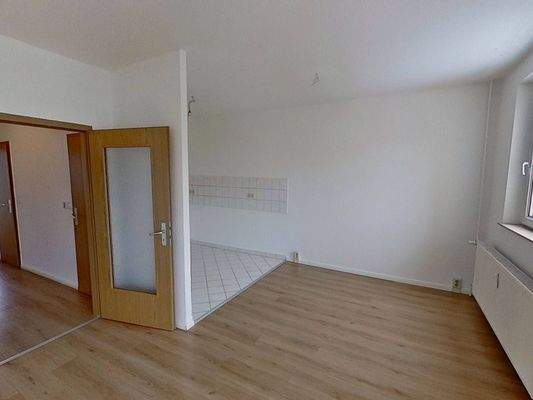 Ansicht III: Wohn- und Esszimmer mit offenem Küchenbereich