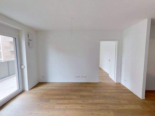 Ansicht V: Wohn- und Esszimmer mit offenem Küchenbereich