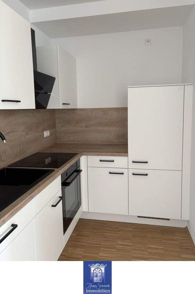 Erstbezug! Charmante Neubauwohnung mit Balkon, schicker EBK und Lift! - Foto 1