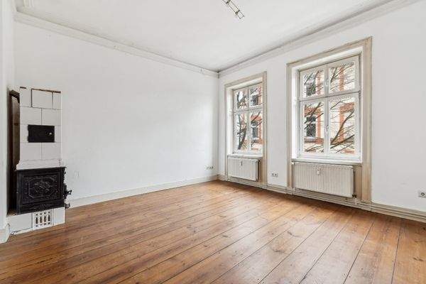 Zimmer 1: Wohnen oder Essen – Sie entscheiden  |  Kachelofen ausschl. Design