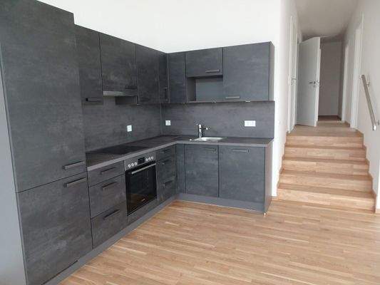 Kochbereich mit Einbauküche