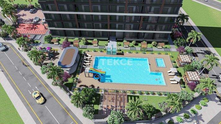 New Apartments in Mersin with a Pool and Modern Landscaping
