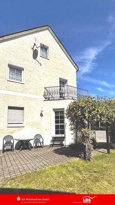 Ansicht mit Balkon und Terrasse WG 1