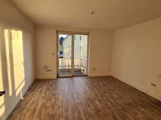 Wohnzimmer mit Balkon