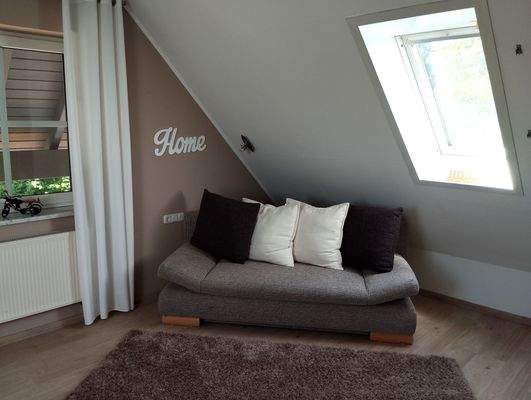 Ruhebereich Fitnessraum im Dachgeschoss.jpg