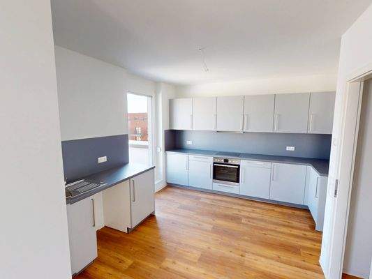 Ansicht III: Wohn- und Esszimmer mit offenem Küchenbereich