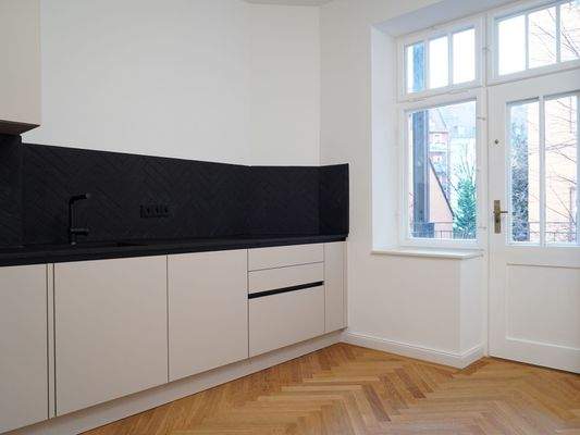 Wohnküche I Zugang Innenhofbalkon